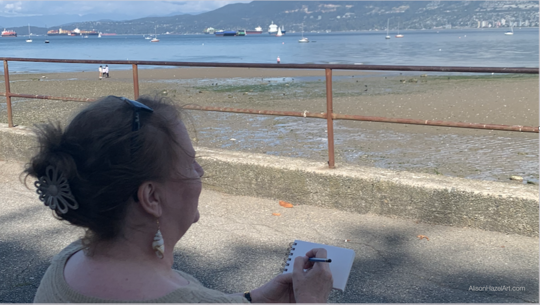 Alison drawing at the beach